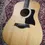 Thumbnail: Full front view of Taylor 110e acoustic guitar – natural spruce top, ebony fretboard, and dreadnought body shape.