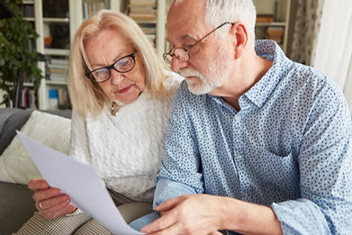 Couple of seniors reading a contract or health care proxy or living will.jpg