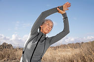medium-shot-woman-stretching-outdoors.jpg