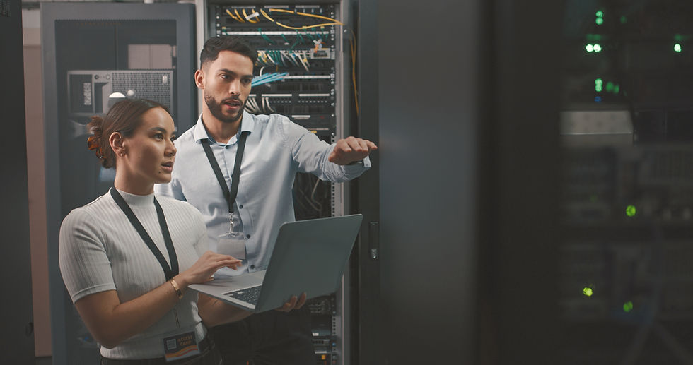 Toronto IT professional analyzing cybersecurity risk assessment data and security graphs on screen