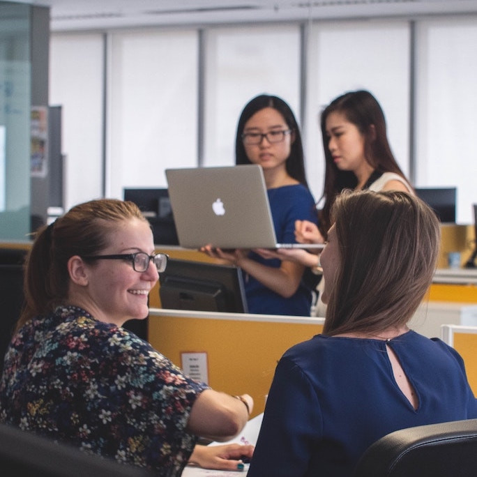 Two pairs of women mentoring each other