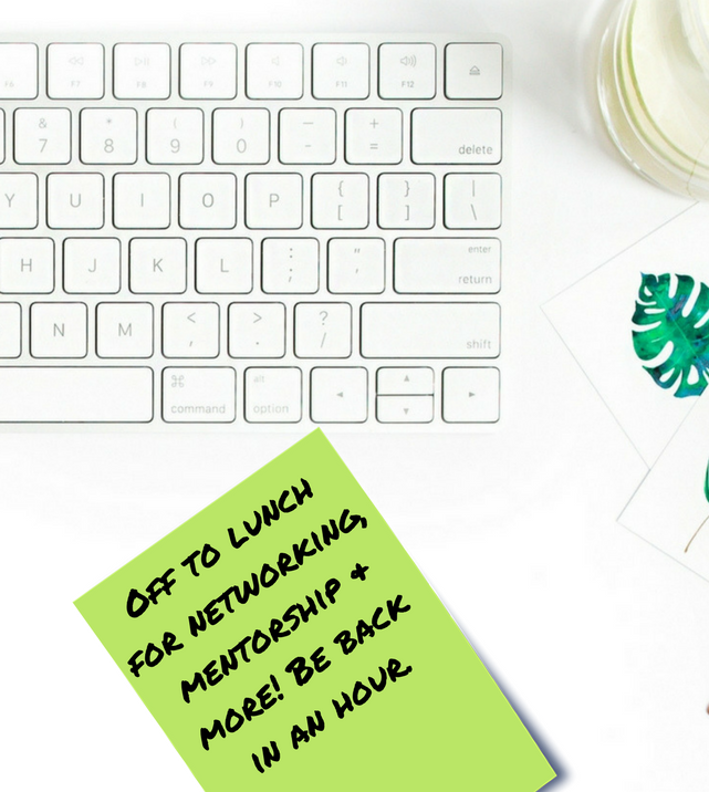 Professional's desk with note "Off to lunch for networking and mentorship. Be back in an hour."