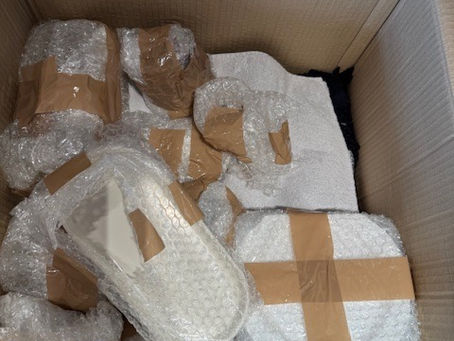 Packed and wrapped household items ready for moving home by The Organised Curator, professional home organiser in London.