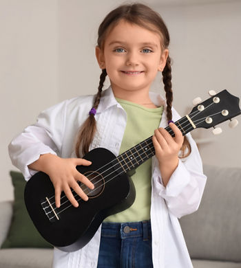 a girl holding a ukulele