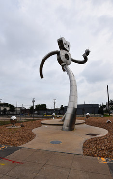 The Traveling Man is Walking Tall Sculpture