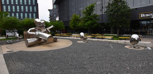 The Traveling Man is Waiting On a Train Sculpture