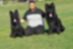 Person Between Two German Shepherd Black Color