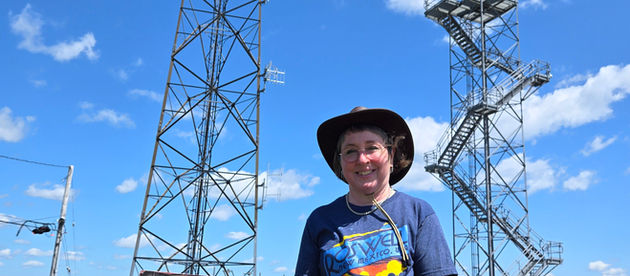 Author Ellen E. Sutherland standing near "Area 51"
