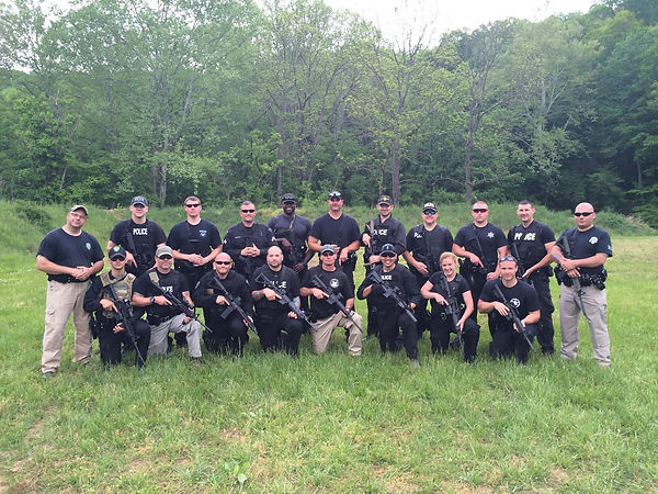 Police officer at BL Outfitters training session, showcasing West Virginia firearms expertise.