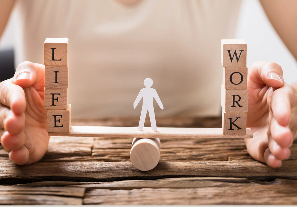 A balance scale with the word "life" on one side, the word "work" on the other and person standing in the middle.