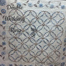 Classic Double Wedding Ring quilt in soft pastel threads