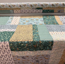 Grasslands quilt in tan, and sage green fabric
