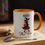 Thumbnail: 15oz accent mug with orange handle and interior, showing a stylish witch holding a pumpkin bag and the text “100% That Witch