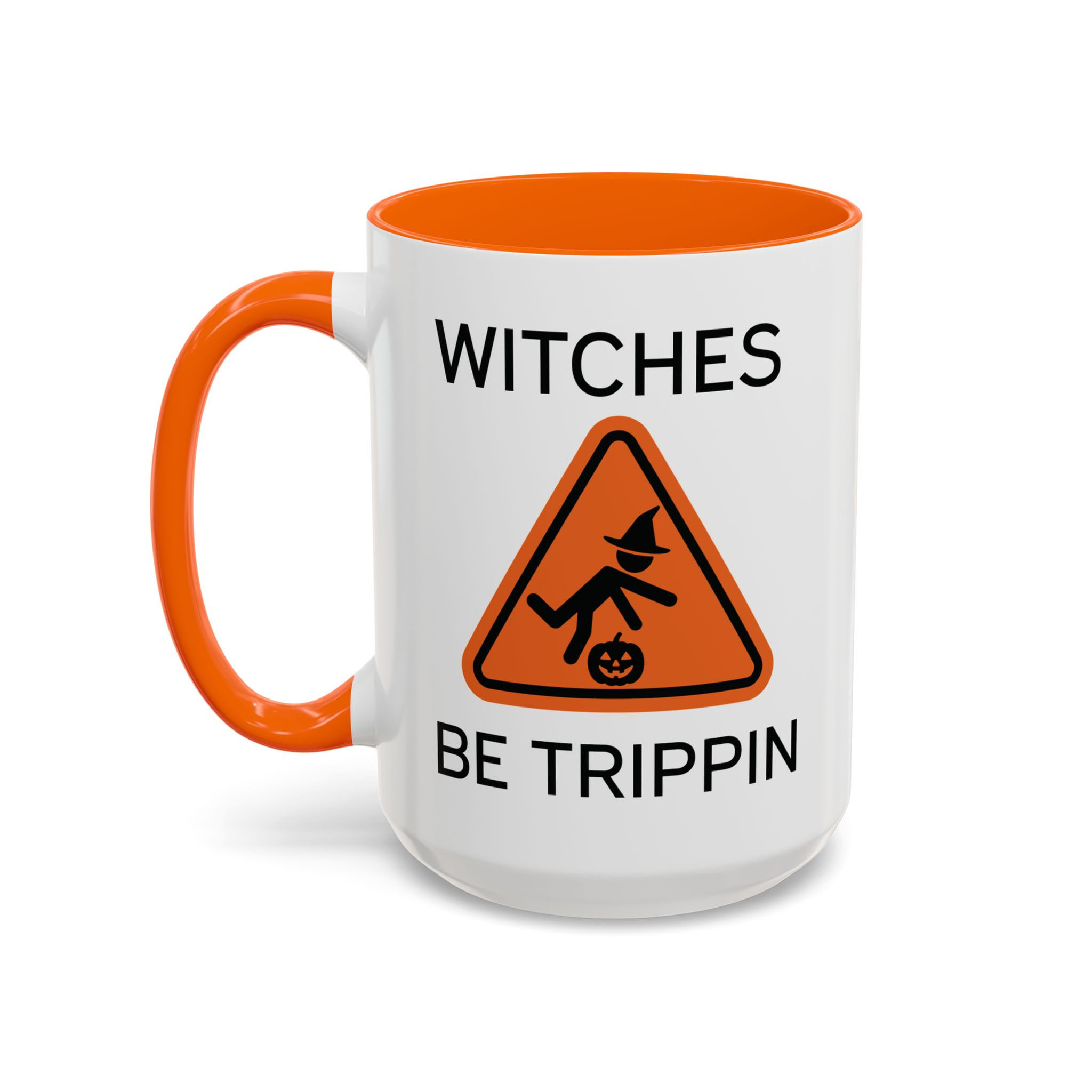 ceramic mug with orange handle and interior, featuring a witch tripping over a pumpkin and the phrase “Witches Be Trippin.”