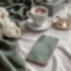 Smartphone resting on a table, symbolising digital marketing and content creation tools used by small business owners in 2025.