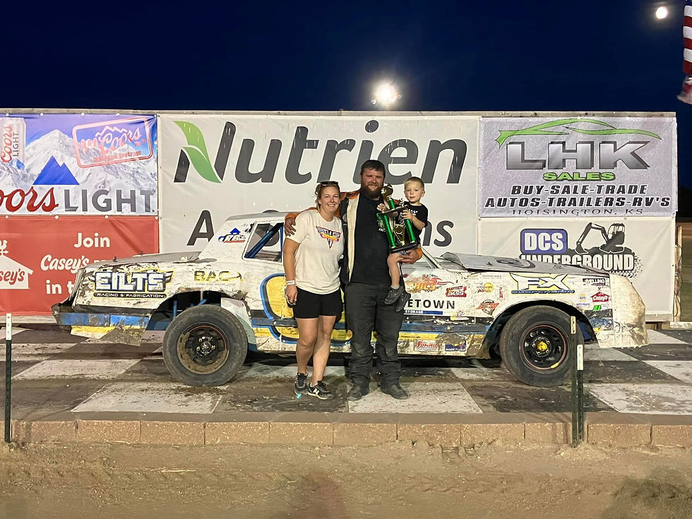 A picture of Zach Olmstead celebrating in victory lane!