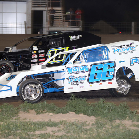 Dylan Sherfick battles Trevor Geist, on his way to his IMCA modified win.