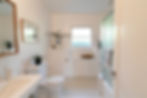 An updated bath with built-in cabinets