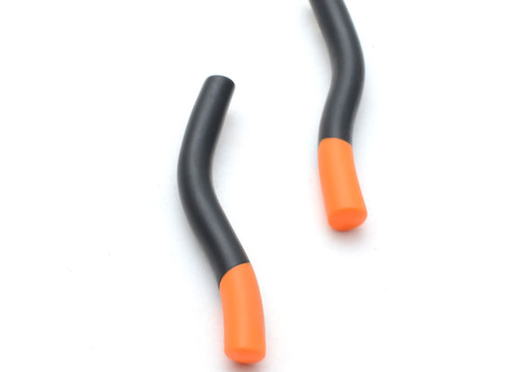 a pair of black and orange earrings on a white surface