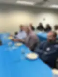 Men eating breakfast together during the Kingdom Builders Christian men's ministry gathering in Turnersville, New Jersey.