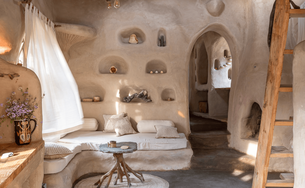 Stunning cob house showcasing organic curves and natural materials for sustainable living.