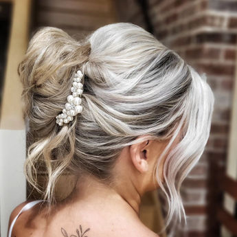 Blonde bridal elegant up do hairstyle with pearl hair clip