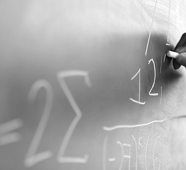 Teacher Writing a Formula on a Blackboard_edited.jpg