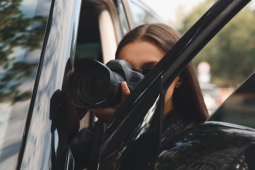 Private detective with camera spying nea