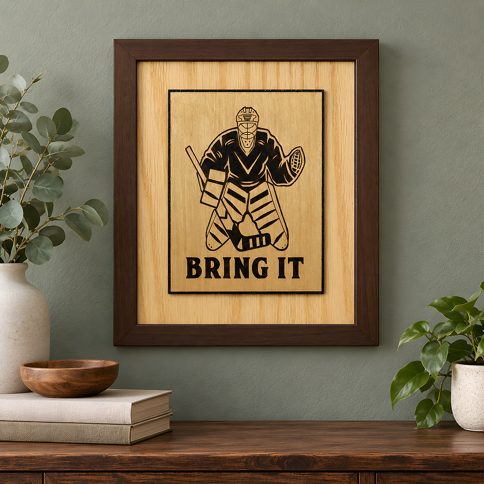 Brown framed hockey goalie wood sign with Bring It lettering and raised birch artwork displayed against a sage green wall.