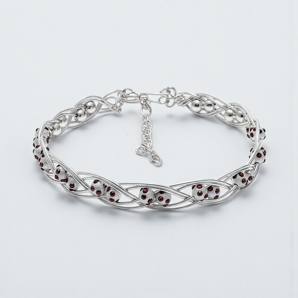 Sterling silver January Birthstone Bracelet with deep red crystal accents and adjustable fit.