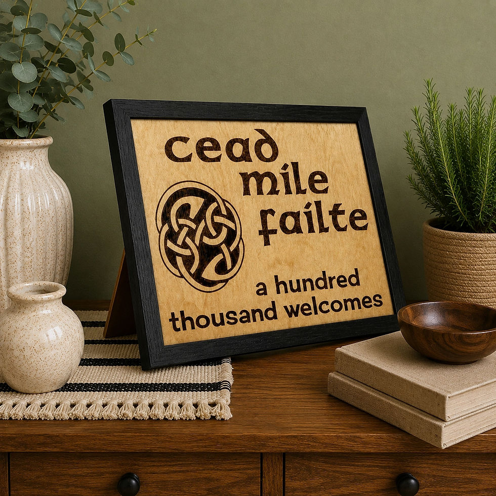 Hand-burned Céad Míle Fáilte Celtic welcome sign in a black frame.