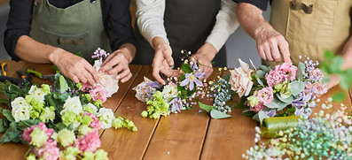 Three people making bouquets.jpeg