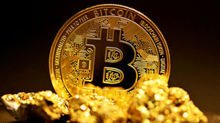 Physical Bitcoin with gold clumps in the foreground.