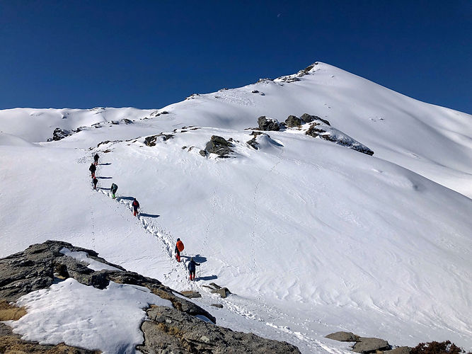 Trekkers Climibing Kedarkantha Peak