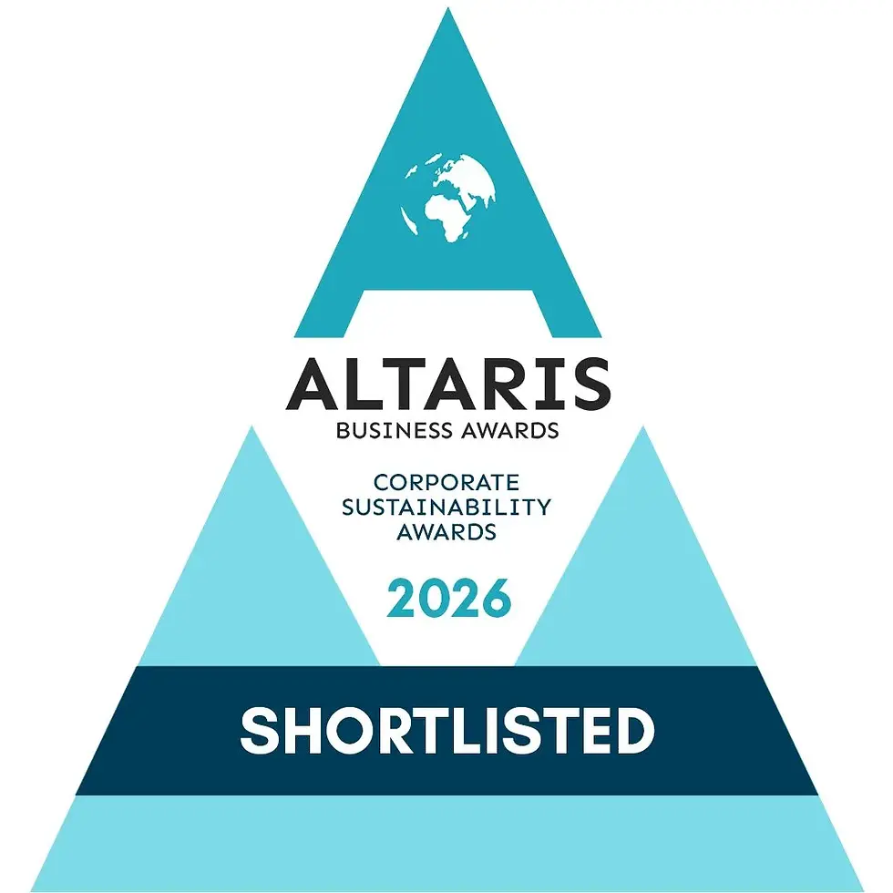 Eye-level view of a green energy wind turbine against a clear sky