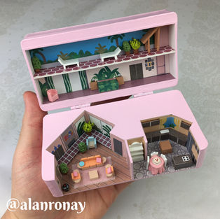Miniature pink house with multiple rooms and a detailed interior, Alan Ronay.