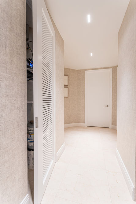 Modern hallway with closet and doors