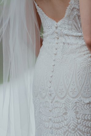 Close up of the texture and detail on a bride's wedding dress.