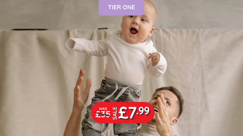a man is holding a baby up in the air with tier one written above it
