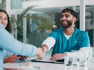 Healthcare workers shaking hands with each other