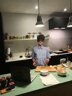 Noah taking safety precautions chopping 