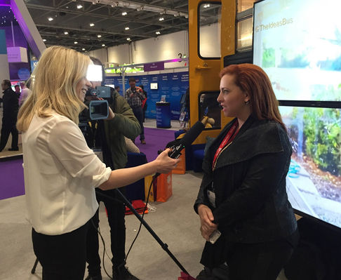 Harary is being interviewed for live broadcasts from a conference