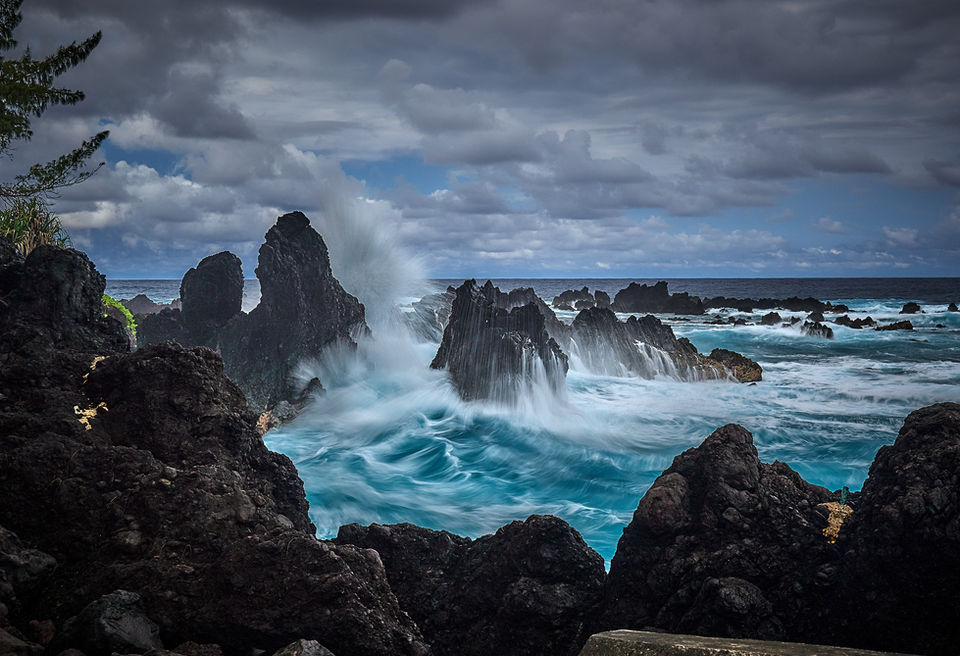There is so much water movement here, that it is interesting to experiment with different exposure lengths to capture the power in different ways. This image looks a bit like a painting, showing the waves surging over the lava stacks.