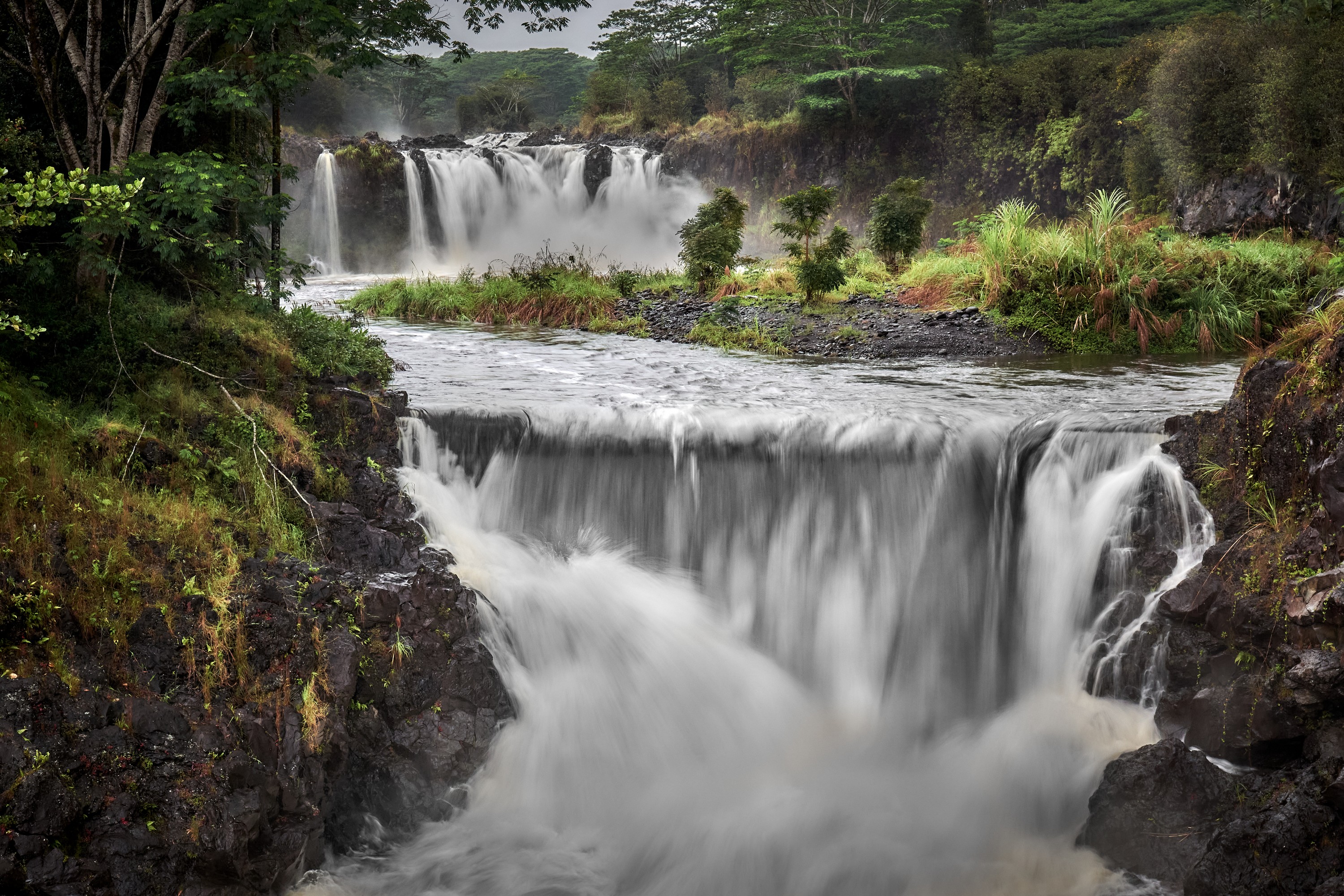 Multiple Tiered Waterfalls with heavy flow near Hilo Hawaii on Wailuku River