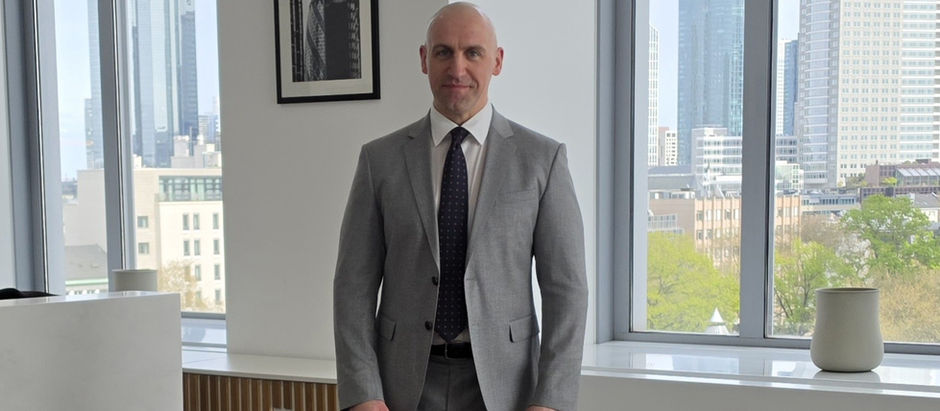 A man standing in the office.