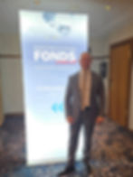 Man stands in front of advertisment