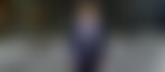 Man standing at the entrance of a building