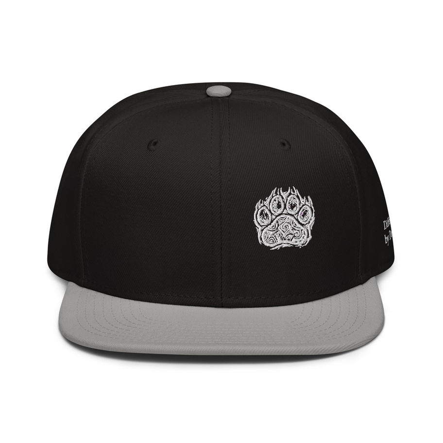 Black and grey snapback hat with embroidered paw graphic.