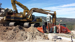 Excavators installing sewer on Orion