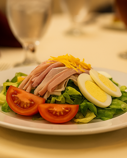 Chef salad with ham, tomatoes, eggs, and lettuce from the Midtown Conference Center catering menu.